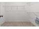 Spacious walk-in closet with multiple wire shelves for organized storage at 22118 Yachtclub Ter, Land O Lakes, FL 34639