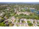 Aerial view of a property with a golf course and lake views in a residential neighborhood at 2327 Morning Glory Trl, Spring Hill, FL 34606