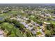 An aerial view of the home shows proximity to the golf course and the home's boundary line to illustrate property size at 2327 Morning Glory Trl, Spring Hill, FL 34606