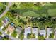 Aerial view showcasing golf course community with lush green fairways and private pool at 2327 Morning Glory Trl, Spring Hill, FL 34606