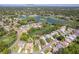 Aerial view of property showcasing proximity to golf course, pond and lush surroundings at 2327 Morning Glory Trl, Spring Hill, FL 34606