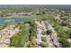 Aerial view showcasing the community's golf course and lake at 2327 Morning Glory Trl, Spring Hill, FL 34606