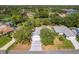 Aerial view featuring the property and nearby golf course and a small lake at 2327 Morning Glory Trl, Spring Hill, FL 34606