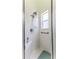Bright, tiled shower with a multi-setting shower head and a corner seat at 2327 Morning Glory Trl, Spring Hill, FL 34606