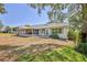 The home features a screened-in porch and patio, perfect for outdoor entertaining at 2327 Morning Glory Trl, Spring Hill, FL 34606