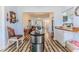 Spacious living area with hardwood floors, open to dining and kitchen with a seamless transition for modern living at 2327 Morning Glory Trl, Spring Hill, FL 34606