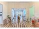 Open-concept floor plan with natural light and wood floors perfect for entertaining, relaxing, and everyday living at 2327 Morning Glory Trl, Spring Hill, FL 34606