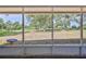 Screened in patio features a view of the golf course outside at 2327 Morning Glory Trl, Spring Hill, FL 34606