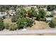 Aerial view showcasing the property's location, surrounded by mature trees and a well-maintained neighborhood at 23409 Dogwood Estates Dr, Brooksville, FL 34601