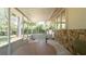 Wide-angle view of a screened-in porch with table and chairs at 23409 Dogwood Estates Dr, Brooksville, FL 34601