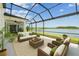 Relaxing lanai with comfortable seating and a gorgeous lake view at 3208 Living Coral Dr, Odessa, FL 33556