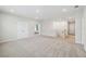 Spacious carpeted loft area with multiple doorways, offering versatile living space at 3208 Living Coral Dr, Odessa, FL 33556