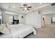 Main bedroom with a tray ceiling and ceiling fan, and white walls and trim at 3208 Living Coral Dr, Odessa, FL 33556