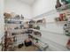 Well-stocked pantry with wire shelving providing ample storage space for food and supplies at 3208 Living Coral Dr, Odessa, FL 33556