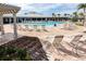 Resort-style swimming pool featuring ample lounge chairs, a pergola, and lush landscaping at 3208 Living Coral Dr, Odessa, FL 33556