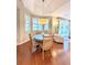 Cozy dining area with natural light and hardwood floors near sliding door at 3655 Square West Ln # 9, Sarasota, FL 34238