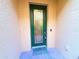 Elegant front door with glass detailing, set in a well-maintained and inviting entryway at 3655 Square West Ln # 9, Sarasota, FL 34238