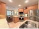 Bright kitchen featuring stainless steel appliances, granite countertops and light wood cabinetry at 3655 Square West Ln # 9, Sarasota, FL 34238