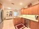 Bright kitchen featuring stainless steel appliances, granite countertops and light wood cabinetry at 3655 Square West Ln # 9, Sarasota, FL 34238