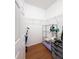 Bright walk-in closet with hardwood floors, wire shelving, and ample storage space at 3655 Square West Ln # 9, Sarasota, FL 34238