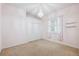 The bedroom features a chandelier, large closet, and a window with shutters at 4080 Gevalia Dr, Brooksville, FL 34604