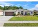 Charming single-story home with manicured lawn and well-maintained landscaping at 4080 Gevalia Dr, Brooksville, FL 34604