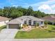 Beautiful single-story home with well-kept lawn, mature trees, and welcoming curb appeal at 4080 Gevalia Dr, Brooksville, FL 34604