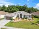 Beautiful single-story home with well-kept lawn, mature trees, and welcoming curb appeal at 4080 Gevalia Dr, Brooksville, FL 34604