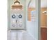 Inviting foyer with decorative glass double doors and light-colored tile flooring at 4080 Gevalia Dr, Brooksville, FL 34604