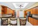 This kitchen offers wood cabinets, granite countertops, a breakfast bar, and stainless steel appliances at 4080 Gevalia Dr, Brooksville, FL 34604