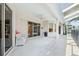 Covered patio with sliding glass doors, ceiling fan and views of the screened-in pool at 4080 Gevalia Dr, Brooksville, FL 34604