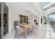 Covered patio featuring an outdoor dining table, ceiling fan, and sliding glass doors leading inside at 4080 Gevalia Dr, Brooksville, FL 34604