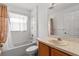 Bathroom with a bathtub, shower, toilet, vanity and mirror at 4335 Duval St, Spring Hill, FL 34606