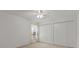 Bright bedroom with a ceiling fan, neutral carpet and a large closet at 4335 Duval St, Spring Hill, FL 34606