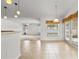 Bright breakfast nook with tile flooring, a large window, and an adjacent living space at 4335 Duval St, Spring Hill, FL 34606