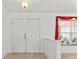 Home entryway featuring tiled floor, a double door, and a view of the interior at 4335 Duval St, Spring Hill, FL 34606
