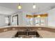 Stainless steel kitchen sink sits below modern pendant lighting and breakfast bar at 4335 Duval St, Spring Hill, FL 34606