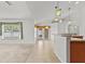 Open concept living area featuring tile floors and natural light at 4335 Duval St, Spring Hill, FL 34606