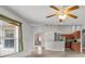 Bright living room with tile floors and view into modern kitchen at 4335 Duval St, Spring Hill, FL 34606
