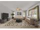 Bright living room featuring modern decor, comfortable seating, and a stylish patterned rug at 4335 Duval St, Spring Hill, FL 34606