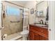 Well-maintained bathroom featuring tiled shower with safety bar, vanity, and modern fixtures at 447 Briarwood Ln, Spring Hill, FL 34606