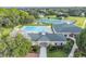Aerial view of the community pool and clubhouse with manicured landscaping at 4500 Golf Club Ln, Spring Hill, FL 34609