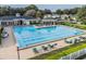 Large community pool featuring lap lanes, lounge chairs, and a shaded gazebo with ample seating at 4500 Golf Club Ln, Spring Hill, FL 34609