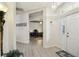 Bright entryway with hardwood floors leads to office and other areas of the home at 4500 Golf Club Ln, Spring Hill, FL 34609