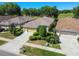Charming home featuring a two-car garage, manicured landscaping, and an inviting entrance with beautiful curb appeal at 4500 Golf Club Ln, Spring Hill, FL 34609