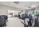 Gym featuring weight machines, free weights, and mirrored walls for a comprehensive workout experience at 4500 Golf Club Ln, Spring Hill, FL 34609