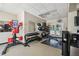 Modern gym area with various weight machines, dumbbells, and fitness equipment for residents at 4500 Golf Club Ln, Spring Hill, FL 34609
