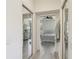 Hallway view into bedroom; featuring mirrored closet doors at 4500 Golf Club Ln, Spring Hill, FL 34609