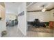 Hallway featuring hardwood floors that leads to the dining and living areas and the office at 4500 Golf Club Ln, Spring Hill, FL 34609