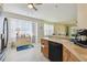 Open kitchen featuring modern appliances, spacious counters, and natural light throughout the space at 4500 Golf Club Ln, Spring Hill, FL 34609